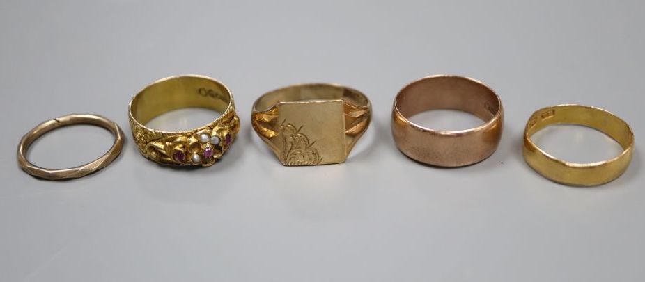 Three 9ct gold rings including Victorian gem set(a.f.), a 22ct band and one other band,